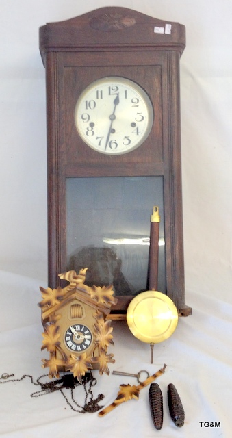 A wall clock and a cuckoo clock