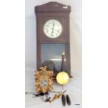 A wall clock and a cuckoo clock