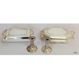 2 silver plated lidded serving dishes and a pair of plated candlesticks (candlesticks 11cm high)