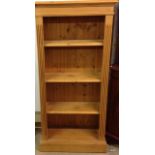 A pine 3 shelf bookcase 138 x 66 x 30