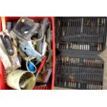 A box of mixed tools and drills