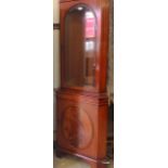 A flame mahogany glass fronted corner unit