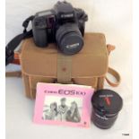 A Canon ES 100 SLR Camera in case with Vivitar Series 1 Lens