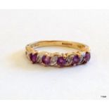 A 9ct gold diamond and amethyst 1/2 eternity ring size N