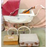 A vintage silver cross pram, a violin, and a vintage suitcase containing books brochures and other