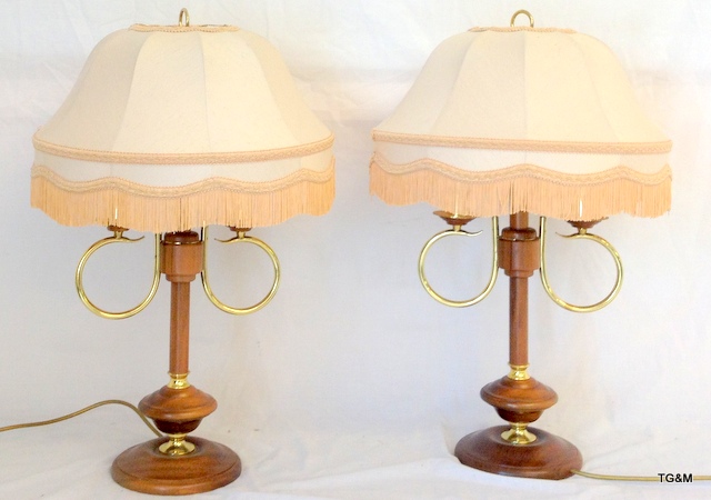 A pair of wooden and brass lamps 66cm high