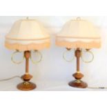 A pair of wooden and brass lamps 66cm high