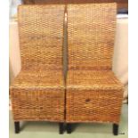 A pair of modern, wicker high back chairs