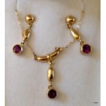 A 9ct Gold Hallmarked Amethyst necklace and earring set