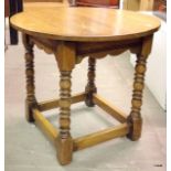 A round oak lamp table