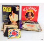 A collection of records 45's and L.ps to include Elvis Presley, Jerry Lee Lewis, Noel Coward and a