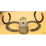 A white metal inkwell inset a horses hoof plus 2 horse shoe brackets