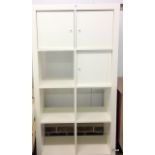 A white bedroom storage unit