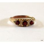 A 9ct gold garnet and diamond ring size O
