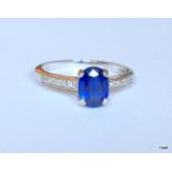 9ct white gold blue stone and diamond shouldered ring, Size N / O