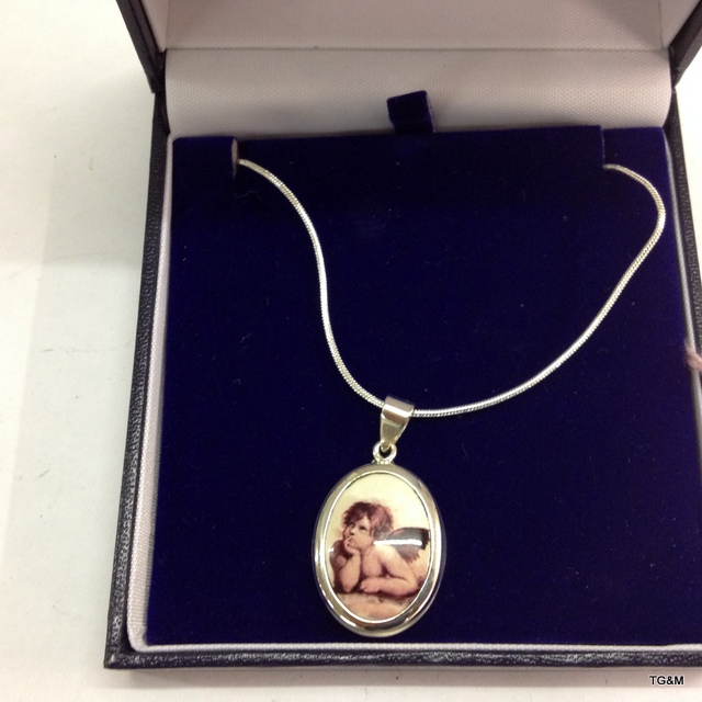 A silver and pictorial enamel set cherub necklace