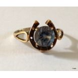 A 9ct gold aquamarine & horseshoe shape ring size O