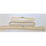 A single string of pearls, a 9ct gold clasp single string of pearls and two similar