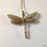 A 9ct White gold Dragon fly pendant on chain