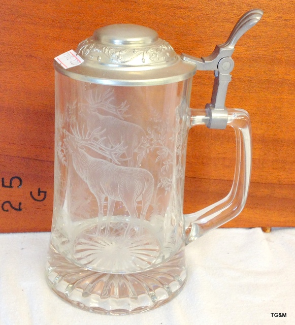 a glass tankard with stag engraving