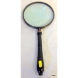 A silver plate 6" magnifying glass
