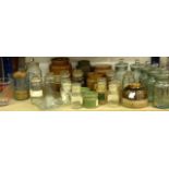 A mixed lot of glass kitchen storage bottles