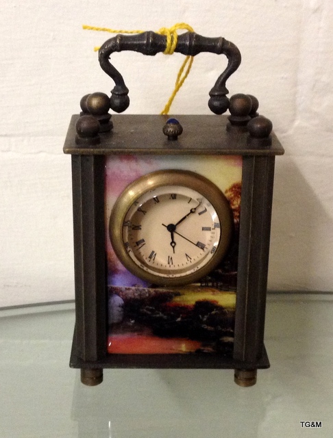 A decorative miniature carriage clock