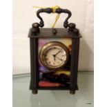 A decorative miniature carriage clock