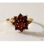 A 9ct gold garnet cluster ring size O
