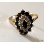 A 9ct gold sapphire cluster ring size M