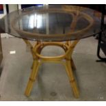 A round glass conservatory table 107cm
