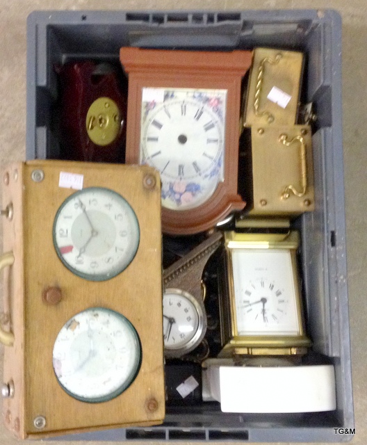 A box of carriage clocks and miniature mantle clocks