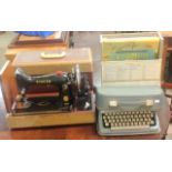 A Brother portable typewriter, singer sewing machine and a collection of records