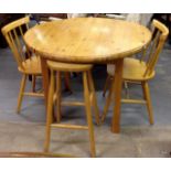 A round pine kitchen table and 2 chairs and pine stool
