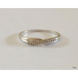 A 9ct white gold diamond crossover ring hallmarked size Size R