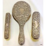 A silver hallmarked brush and mirror set