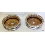 A pair of silver plated wine coasters 15cm diameter x 5cm deep