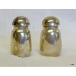 A pair of sterling silver condiments