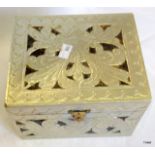 A white metal jewellery box with 6 metal serviette holders inside