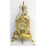 A French brass mantle clock with key and pendulum 47 x 26 x 14