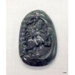 A detailed carved Jade tablet