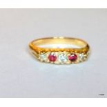 An antique 18ct gold diamond and ruby ring, size M