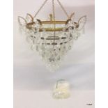 A 6 level crystal chandelier and spare crystals