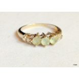 A 10 ct white gold ladies diamond and aquamarine ring size L
