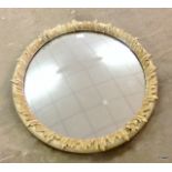 A round mirror with gilt decoration 40cm in diameter