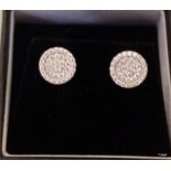 A pair of silver and CZ earrings