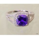 A silver and CZ simulated tanzanite ring