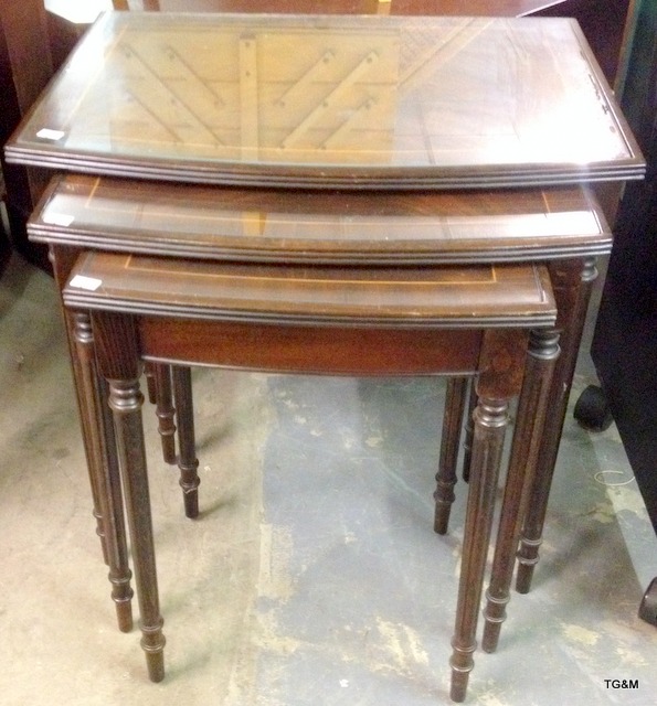 A nest of tables and dark wood desk (not shown)