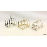 A silver toast rack and pair of Walker and Hall matched toast racks