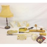 A collection of miscellaneous brass items to include Trivets, fire dogs, Lights, lamp and door